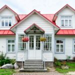White cottage with a garden